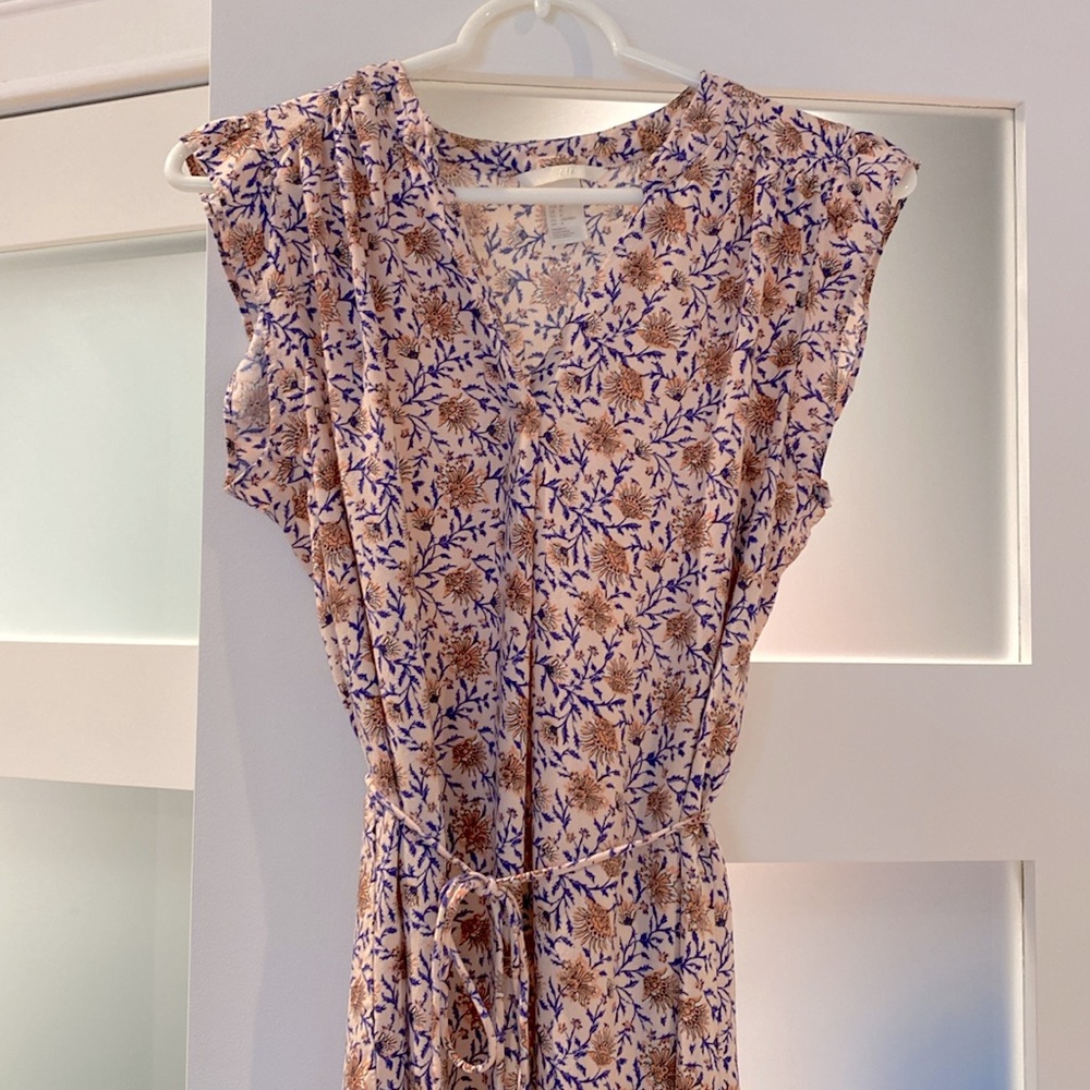 H&M floral dress. Light pink and blue pattern. Tie string loops still attached